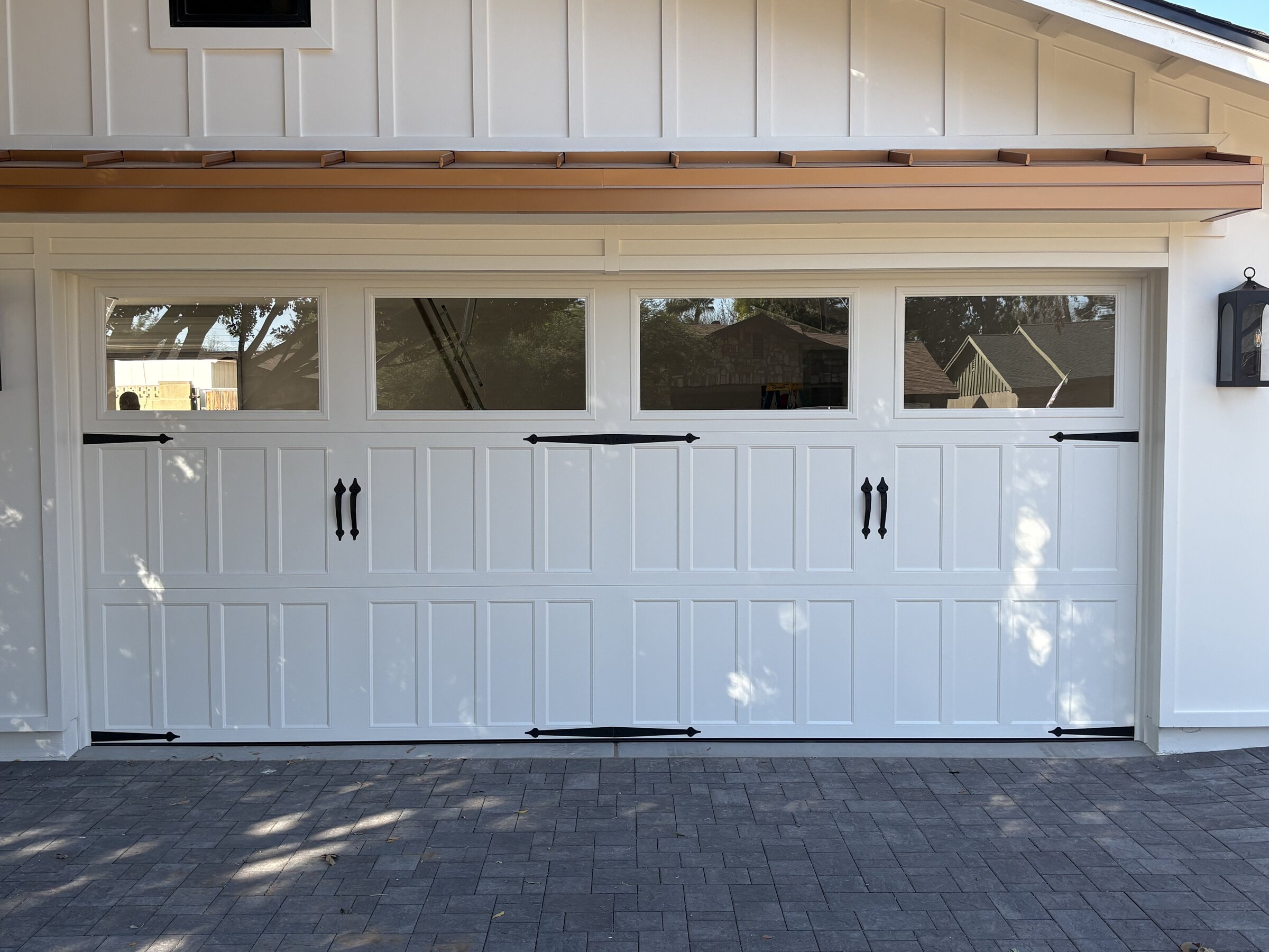 Phoenix home with newly installed white garage doors